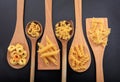 Various shapes of pasta on a black background Royalty Free Stock Photo