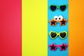 Various shapes of Sunglasses on multicolored background