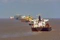 Various ships queue offshore approaching Shanghai.