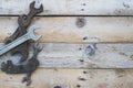 Various size spanners, wrenches on wooden background