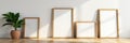 Various sized empty wooden frames against a sleek modern wall, wooden, different shapes, house Royalty Free Stock Photo
