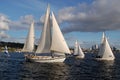 Various sized sailboats race on Lake Union