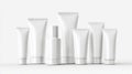 Various sizes of blank cosmetic tubes arranged on a white surface Royalty Free Stock Photo