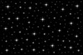 Various sizes and mixed white stars on a black background