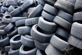 various sizes of tyres stacked in a pyramid structure