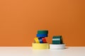 Various skeins of multicolored scotch tape and electrical tape onorange background, copy space
