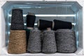 Various skeins of thread on the shelves. Bobbins of yarn