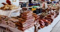 Various smoked meats, sausages and bacon on a market counter for sale Royalty Free Stock Photo