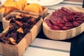 Various snacks in the handcrafted wooden plate