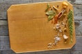 Various spices arranged on wooden copping board