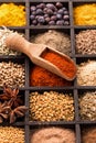 Various spices in box and shovel closeup Royalty Free Stock Photo