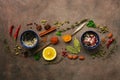 Various spices, herbs and seasonings on a brown rustic background. Top view, flat lay Royalty Free Stock Photo