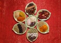 Various Spices in seven plates on glitter