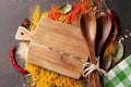 Various spices spoons and cutting board Royalty Free Stock Photo
