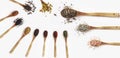 Various spices spoons on white table. Top view with copy space. Royalty Free Stock Photo