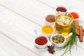 Various spices on white wooden background