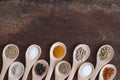 Various spices in wooden spoon on wood table background Royalty Free Stock Photo