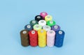 spools of sewing cotton thread of different colors