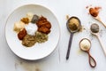 Various spoons with messy piles of spices used to make a taco seasoning blend. Royalty Free Stock Photo