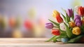 various spring flowers tulips on table with bokeh copy space