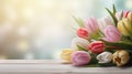 various spring flowers tulips on table with copy space