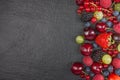 Various summer Fresh berries in a bowl on rustic wooden table. Antioxidants, detox diet, organic fruits. Top view Royalty Free Stock Photo