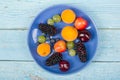 Various summer Fresh berries in a bowl on rustic wooden table. .Antioxidants, detox diet, organic fruits. Top view Royalty Free Stock Photo