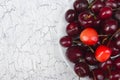 Various summer Fresh Cherry in a bowl on rustic wooden table. Antioxidants, detox diet, organic fruits. Top view. Berries Royalty Free Stock Photo