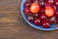 Various summer Fresh Cherry in a bowl on rustic wooden table. Antioxidants, detox diet, organic fruits. Berries Royalty Free Stock Photo