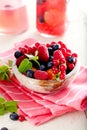 Various summer fruits in a bowl. Assorted fresh berries with lea Royalty Free Stock Photo