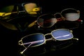 Various sunglasses and polarization glasses on a black background. Royalty Free Stock Photo