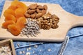 Various superfoods. Healthy food.Nuts, dried fruits and muesli. Close up. Small elements -seeds, almonds, fruit. Top view, Copy sp Royalty Free Stock Photo