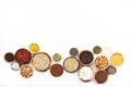 Various superfoods, legumes, cereals, nuts, seeds in bowls on white background. Superfood as chia, spirulina, beans, goji berries