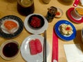 various sushi dishes on plates are served on the table Royalty Free Stock Photo