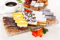 Various sweet cakes on oblong plate