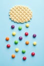 candies arranges as drops of rain from candy cloud, flat layout, minimal design, top view