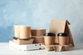 Various takeout containers on table.