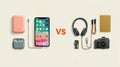 Comparison of Modern Technology Gadgets Including a Smartphone, Headphones, and Camera on a Neutral Background Royalty Free Stock Photo