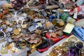 Various things on the counter of the flea market, jewelry and various containers