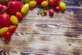 Various tomatoes on a wooden background, vegetables tomatoes yellow, orange, red, black, green Royalty Free Stock Photo