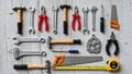 Various tools neatly arranged on a wooden surface, including hammers, adjustable wrenches, pliers, Royalty Free Stock Photo