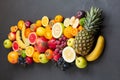 Various tropical fruits on black background, top view Royalty Free Stock Photo