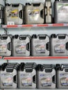Various type of engine oil for sale at car service center shelf.