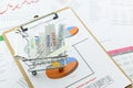 Various type of financial and investment products in a trolley. Royalty Free Stock Photo