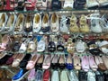 Discount of women Shoes,sneakers and handbags are displayed on the racks for sale in the store