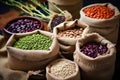 various types of beans in small burlap sacks Royalty Free Stock Photo
