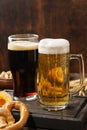 Various types of beer - light and dark and snack variety. Royalty Free Stock Photo