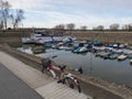 Various types of boats moored in the winter port along the Drava River in Osijek Royalty Free Stock Photo