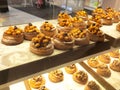 Various types of breads are displayed for sale inside the bakery display rack. Royalty Free Stock Photo