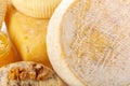 Various types of cheese displayed with honey and nuts on a wooden surface Royalty Free Stock Photo
